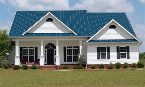 blue house with green metal roof|houses with blue roofs pictures.